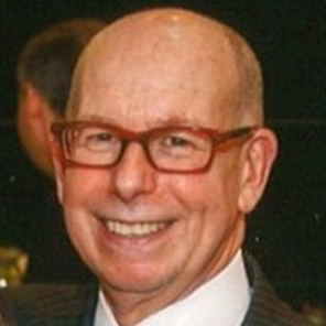 Headshot image of a man smiling.