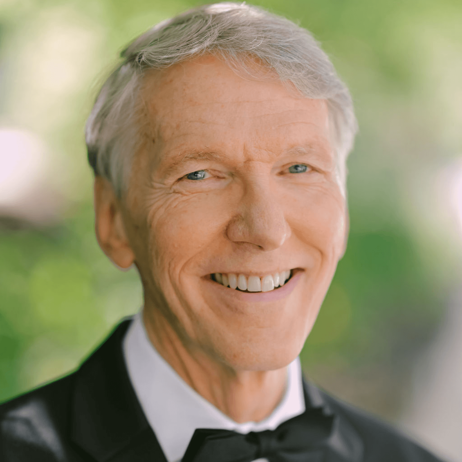 Headshot image of a man smiling.