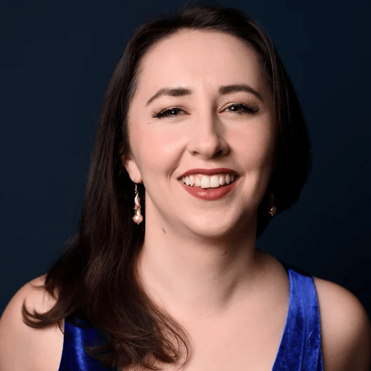 Portrait of Valérie Filloux smiling, wearing a dress